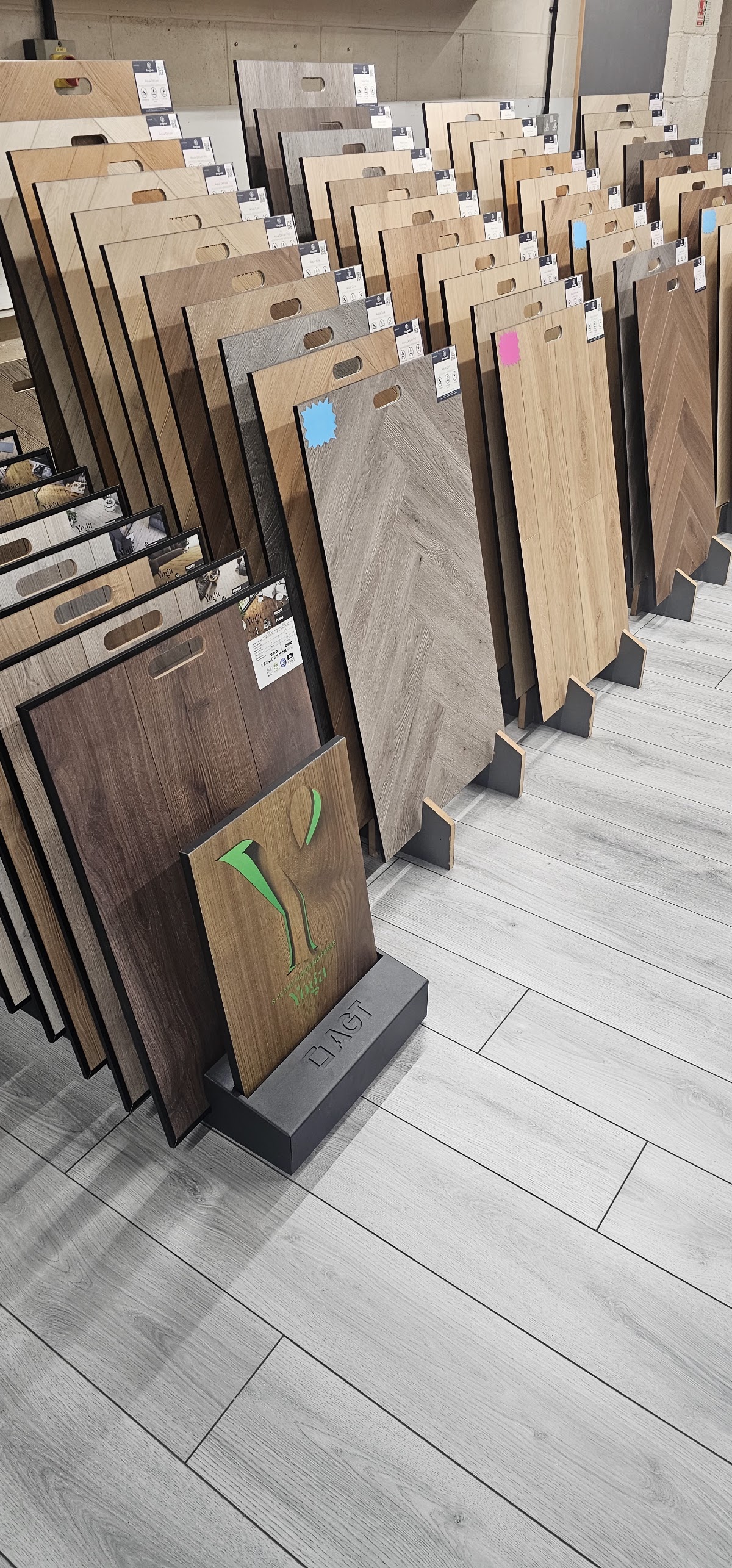 Wood and laminate sample boards on display in the Ideeal Flooring showroom