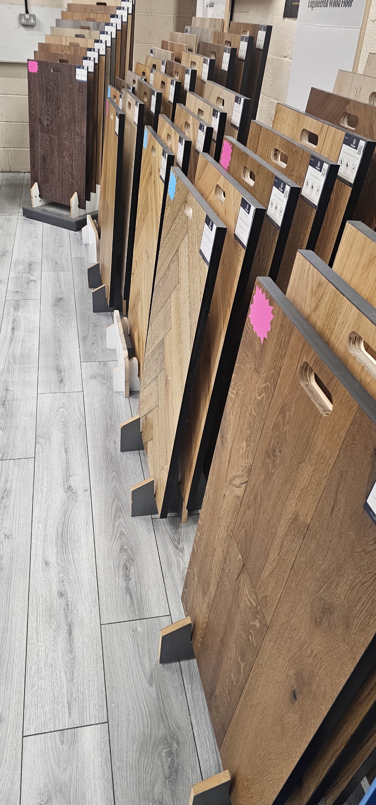 Engineered wood flooring samples lined up in the showroom