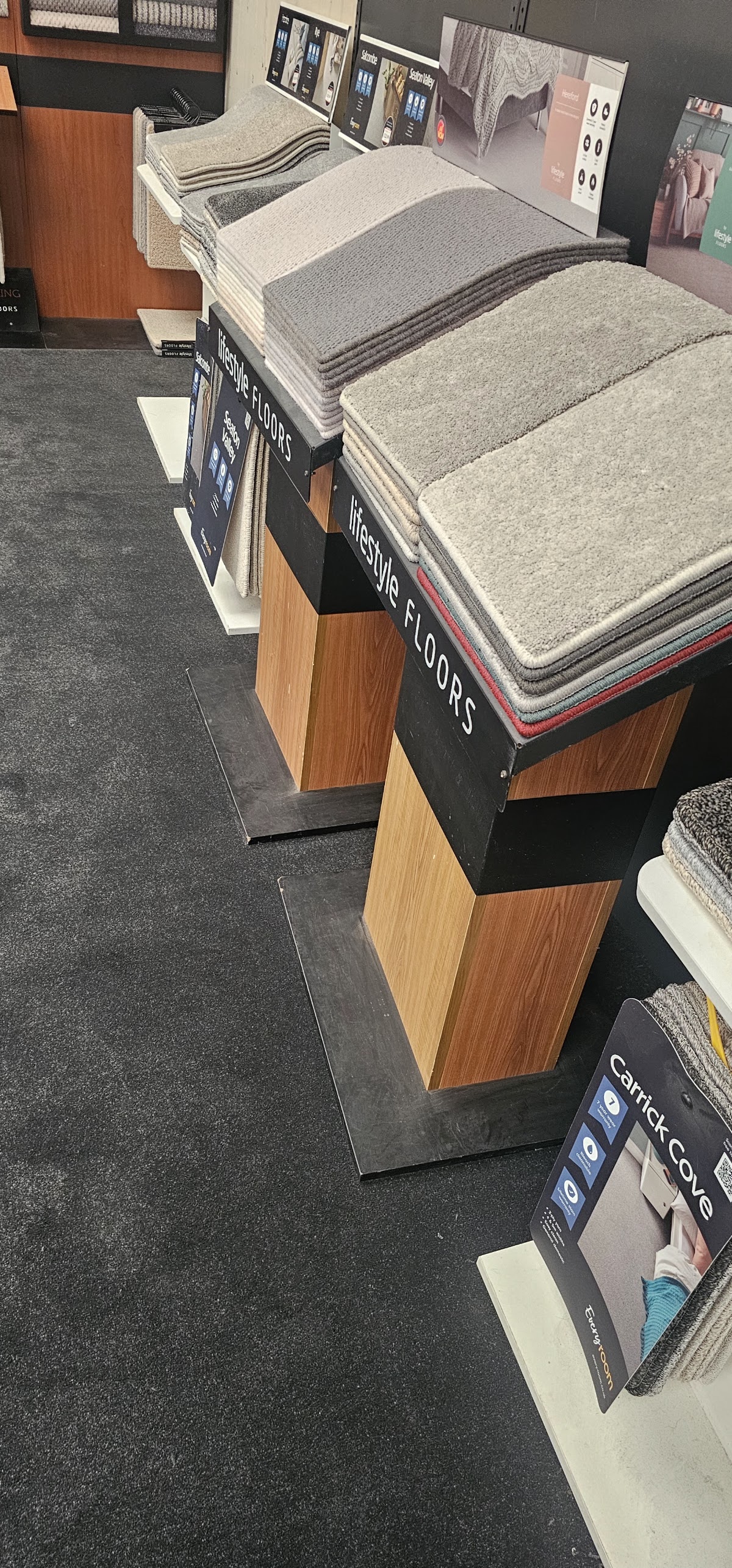 Carpet samples on a display stand at Ideeal Flooring